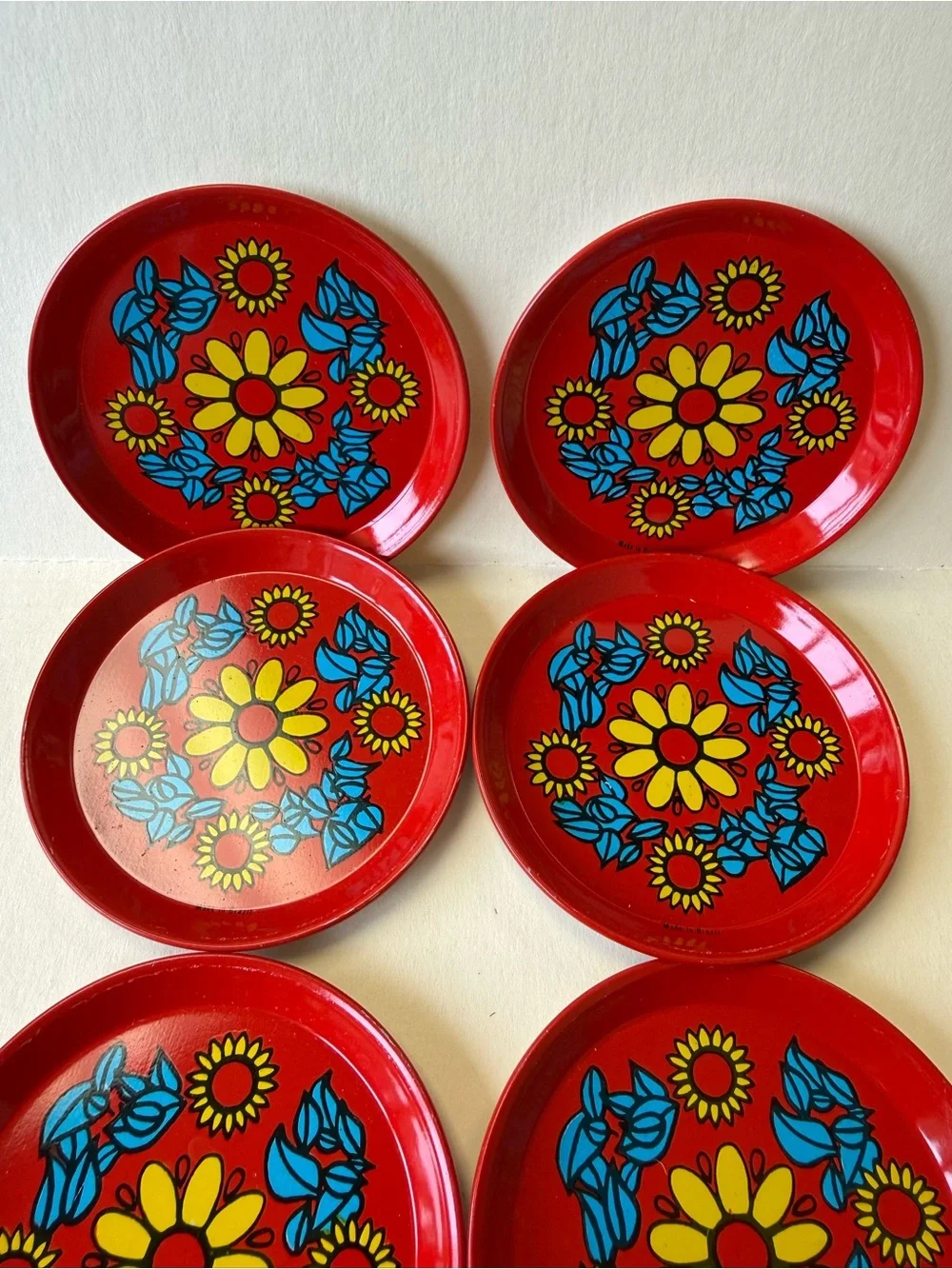 Vintage Set of 6 MCM Metal Floral Coasters in Red Yellow and Blue Made in Brazil